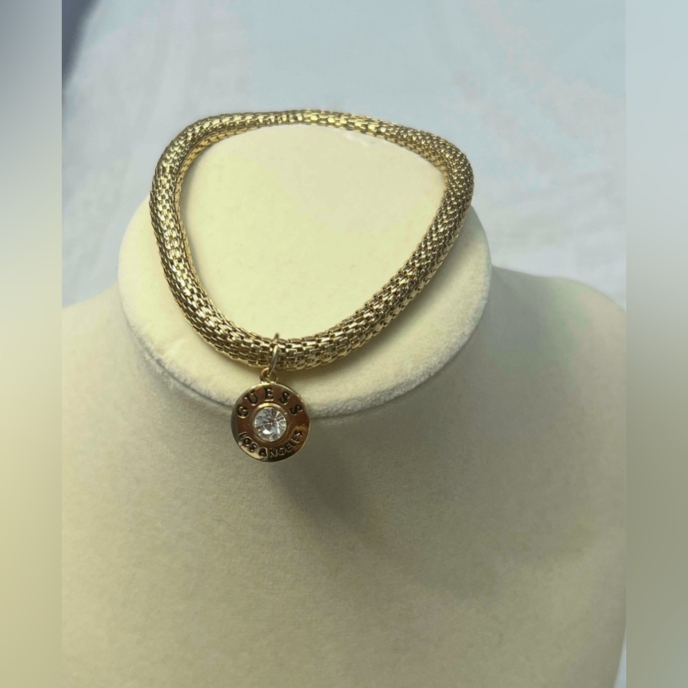 Guess Gold-Tone Stretch Bracelet with Guess Crystal Charm